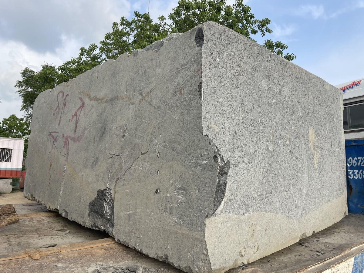 Rajasthan Commercial Grade Granite showing natural variations marked with red circles